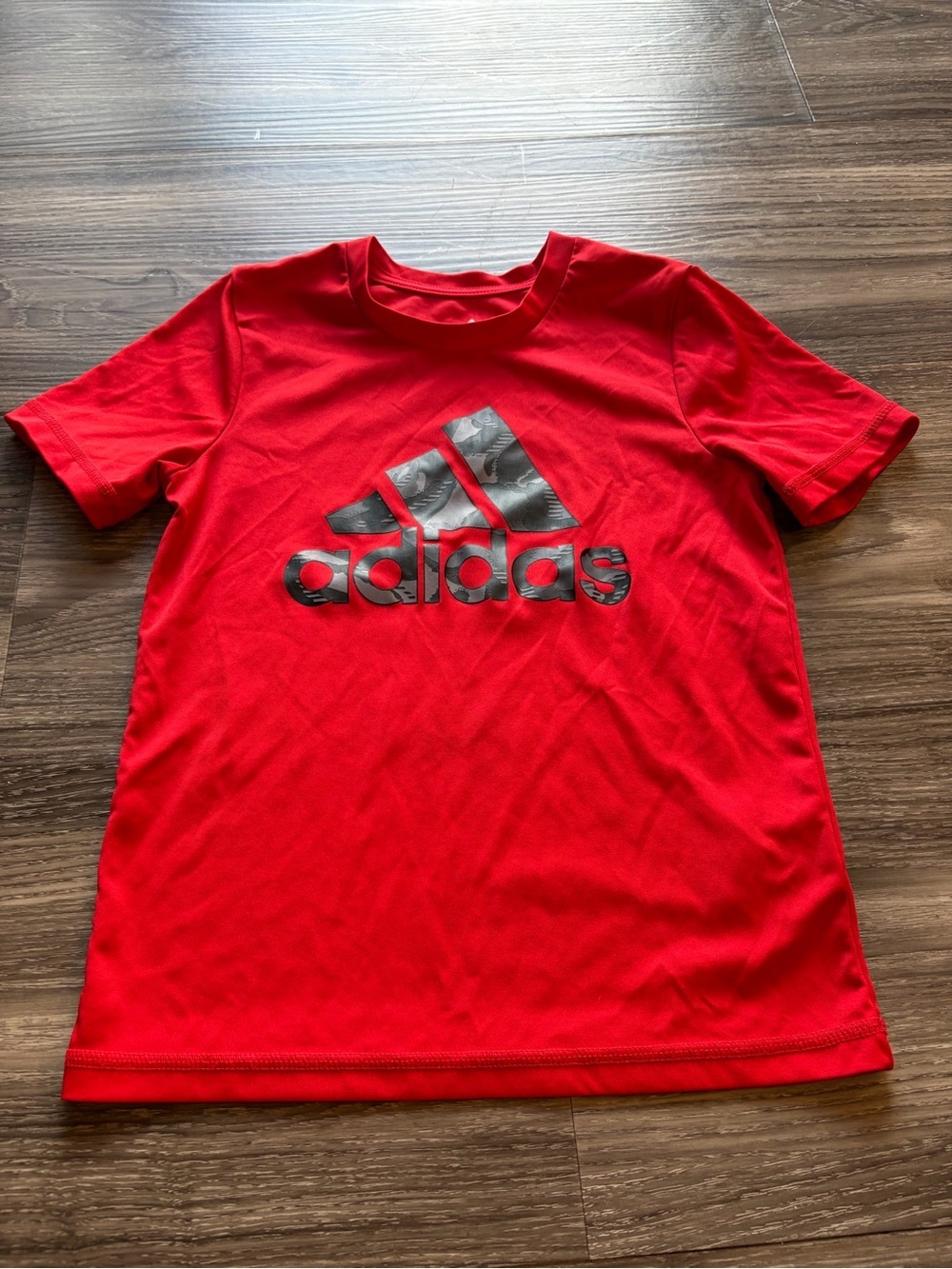 Adidas Bright Red Tee with black front 
 Logo Size 6